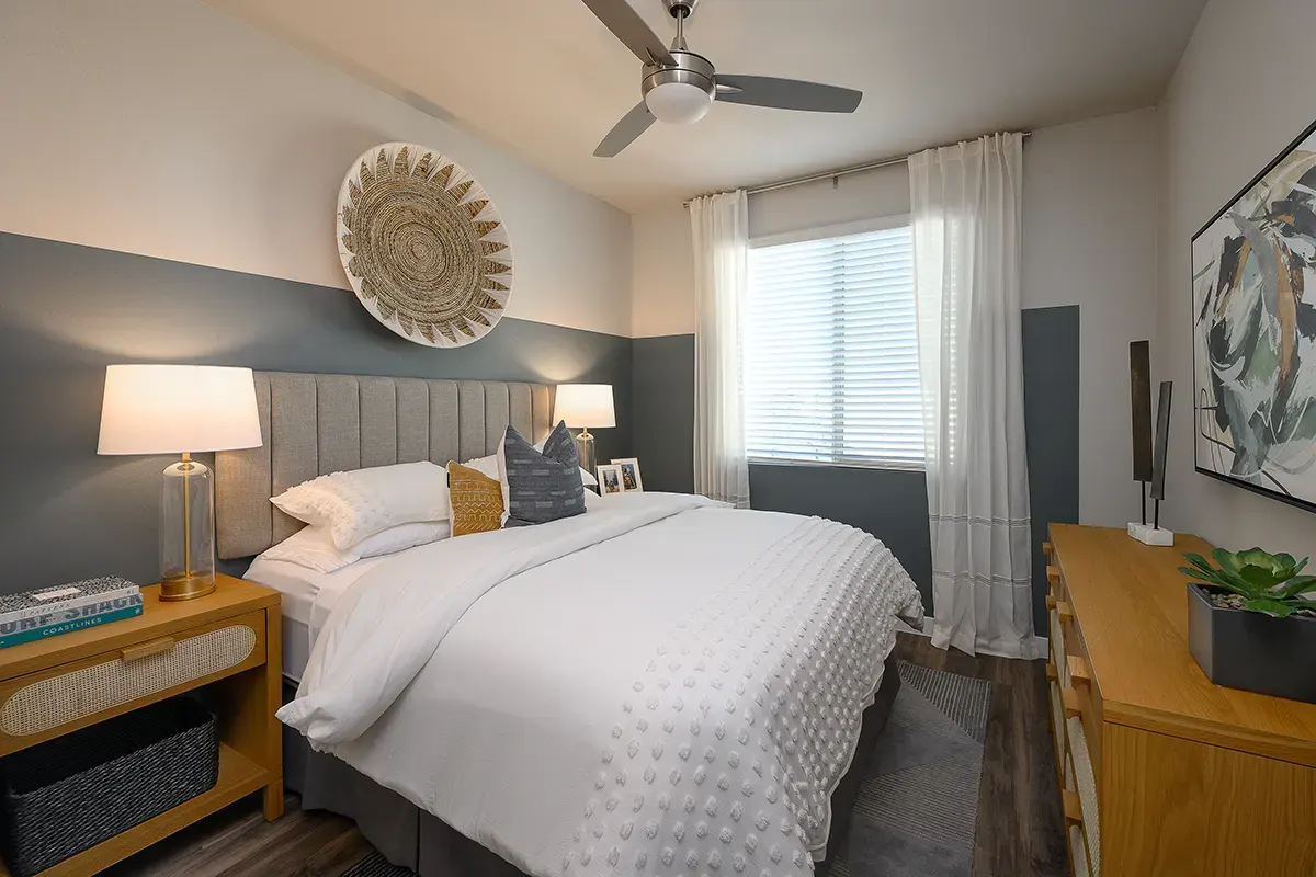 Furnished bedroom shown — representative home at Village at Camelback Park.