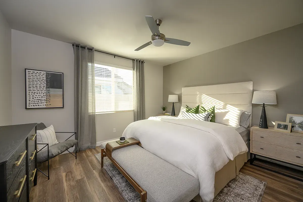 Furnished bedroom shown — representative home at Village at Camelback Park.