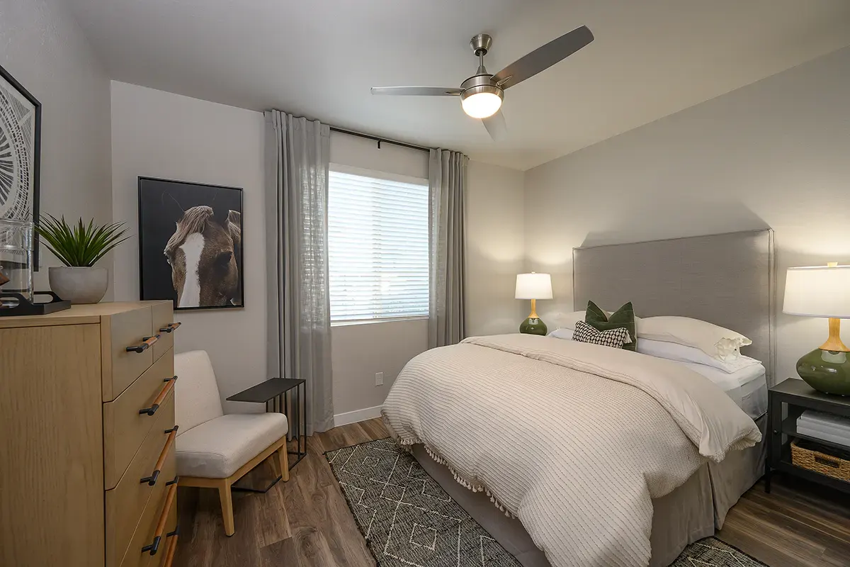 Furnished bedroom shown — representative home at Village at Camelback Park.