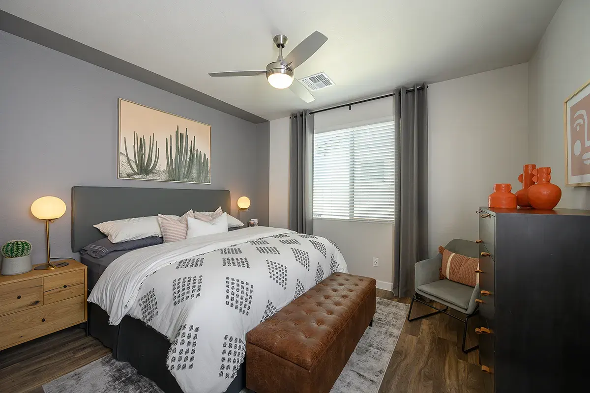 Furnished bedroom shown — representative home at Village at Camelback Park.